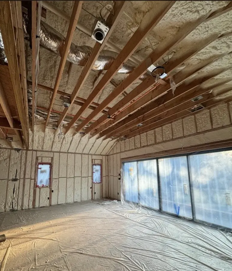 Interior walls and ceiling insulated with spray foam during new construction in Crafton